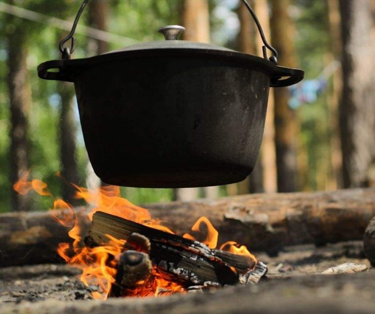 Camping recipes - cast iron dutch oven cooking over campfire
