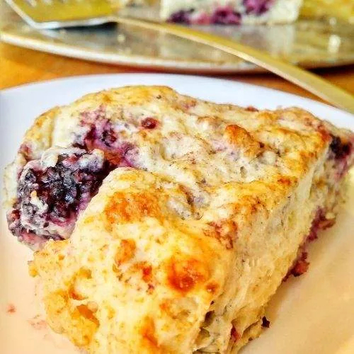These blackberry scones are so delicious! Yummy, juicy blackberries in every bite, this is also a super easy blackberry scones recipe, with only 4 ingredients! Make these quick blackberry scones for breakfast, brunch, dessert, with your coffee or tea, or a quick snack to take on the go. They are super kid-friendly too! These simple blackberry scones don’t even require a rolling pin, and they are great for kids to help with! Try these!! | homemade scones recipe