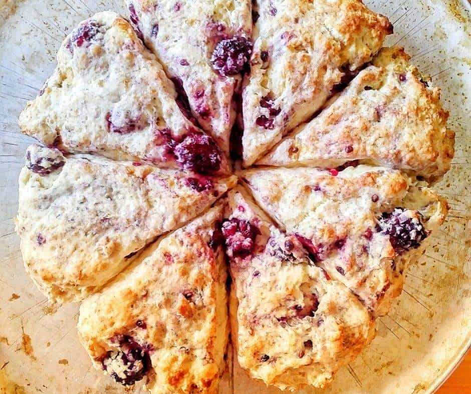 These blackberry scones are so delicious! Yummy, juicy blackberries in every bite, this is also a super easy blackberry scones recipe, with only 4 ingredients! Make these quick blackberry scones for breakfast, brunch, dessert, with your coffee or tea, or a quick snack to take on the go. They are super kid-friendly too! These simple blackberry scones don’t even require a rolling pin, and they are great for kids to help with! Try these!! | homemade scones recipe