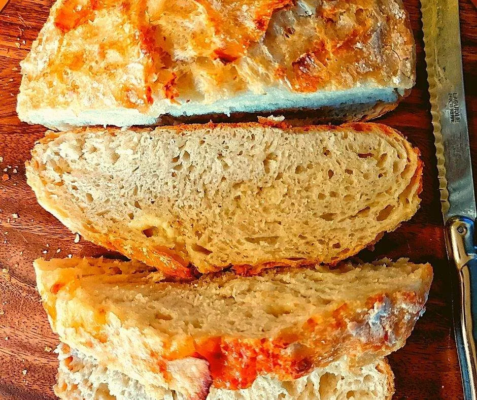 Sliced cheese bread showing crunchy cheese crust