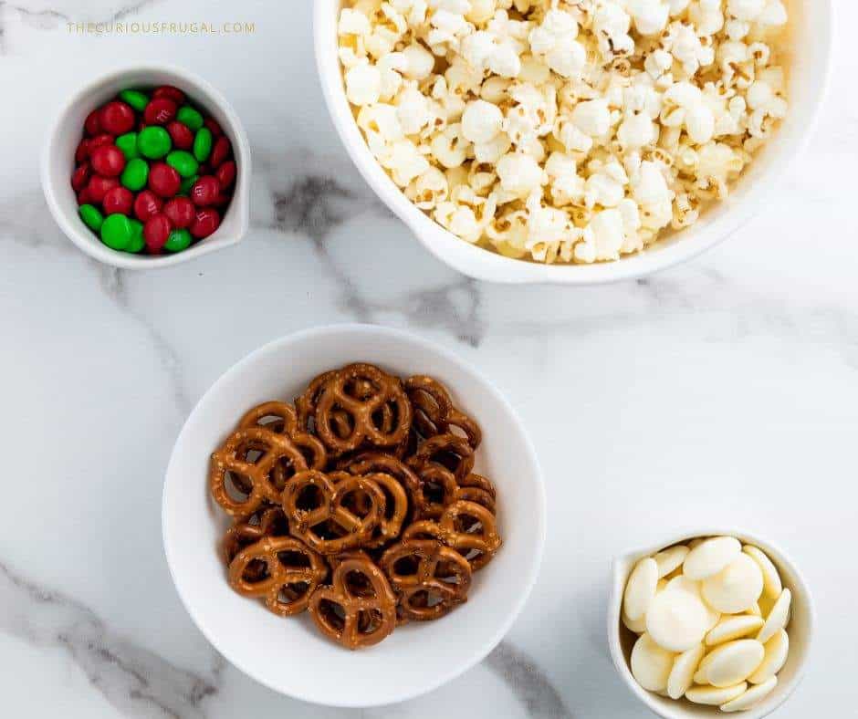Make this easy Christmas popcorn for your next holiday movie night or party! This sweet and salty Christmas snack mix is loaded with chocolate, candy, and festive sprinkles — the perfect holiday treat for gifting or snacking. A quick Christmas recipe idea everyone will love!
